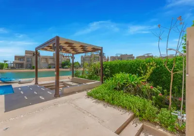 a gazebo in a yard with a pool at Breezy Lagoonfront Escape 3BR with Private Pool I Tawila El Gouna in Hurghada
