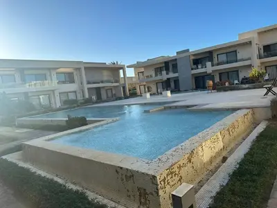 a swimming pool in front of a building at Elgouna g-cripes b-7 in Hurghada