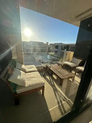 a balcony with a view of a pool on a building at Elgouna g-cripes b-7 in Hurghada