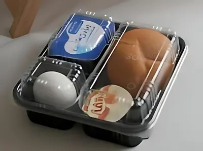 a plastic container with an egg and other items at Sun City in Aswan