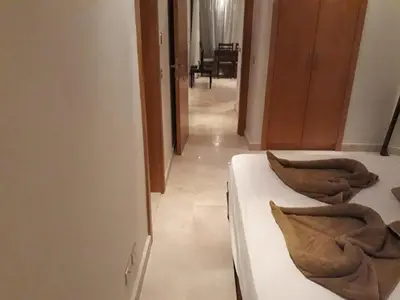 a room with two beds with pillows on them at elgouna scarab es first floor in El Gouna