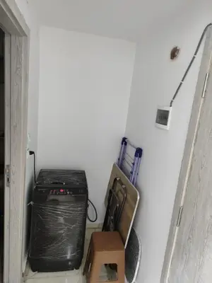 a room with a black cpu in a wall at Cozy Modern Apartament in Hurghada