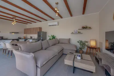a living room with a couch and a table at Luxury 2 Bedrooms in Bali - Elgouna with pool in Hurghada
