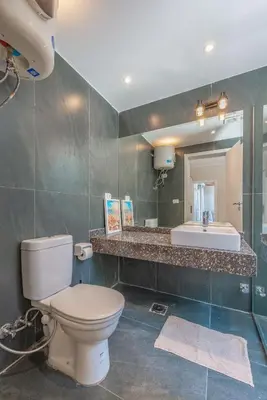 a bathroom with a toilet and a sink at Luxury 2 Bedrooms in Bali - Elgouna with pool in Hurghada