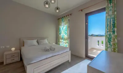 a bedroom with a bed and a large window at Luxury Stays in Cyan El Gouna in Hurghada