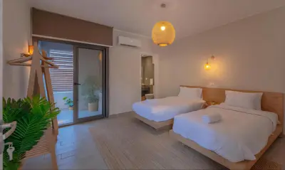 a bedroom with two beds and a large window at Luxury Stays in Bali El Gouna in Hurghada