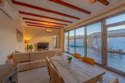 a living room with a table and a couch at Luxury Stays in Bali El Gouna in Hurghada