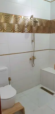 a bathroom with a toilet and a sink at Jahmed Country Villa Luxor West Bank in Al Aqālitah