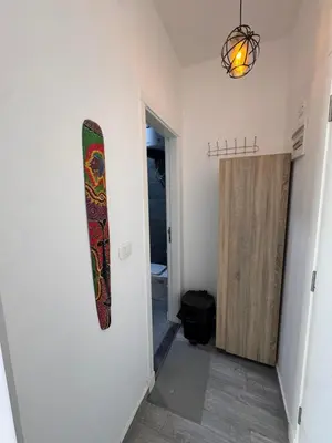 a surfboard hanging on a wall in a room at Studio 511 imperial resort in Hurghada