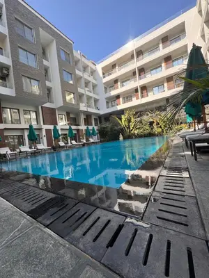 a swimming pool in front of a building at Studio 511 imperial resort in Hurghada