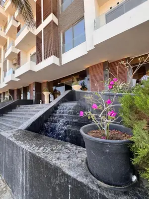 a water fountain in the middle of a building at Studio 511 imperial resort in Hurghada