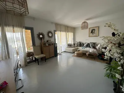 a living room with a couch and a table at Ground Modern Apartment in Hurghada