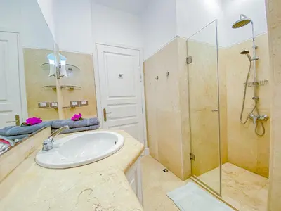 a bathroom with a sink and a shower at Modern 2 bedroom apartment in El Gouna with pool in Hurghada