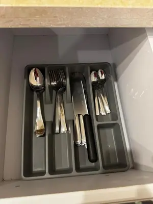 a plastic tray with utensils in a drawer at Aqua Palms Resort Hurghada in Hurghada