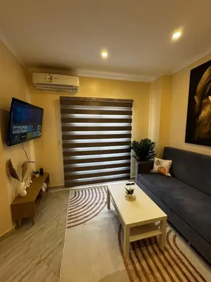 a living room with a couch and a table at Aqua Palms Resort Hurghada in Hurghada