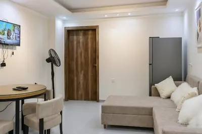 a living room with a couch and a table at Hurghada HUB Resort in Hurghada