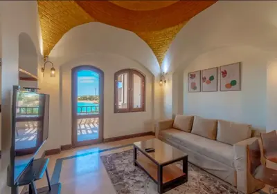 a living room with a couch and a table at Luxury Stays in Nubia El Gouna in Hurghada