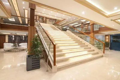 a staircase in a building with wooden railings at 4 nighhts luxury Nile cruise from Luxor to Aswan in Qena