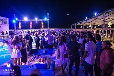 a large group of people standing in front of a crowd at SELENA BAY Luxury Suite beach front hurghada Arena Bar & restaurant سويت فاخر سيلينا باى in Hurghada