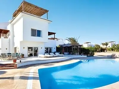 a large swimming pool in front of a house at Coral Blue 'An expansive spacious 4 bedroom villa in El Gouna' in Hurghada