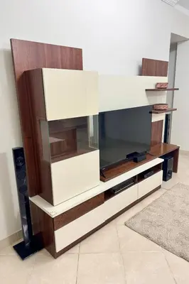 a large entertainment center with a flat screen tv at Modern apartments by the Red Sea in Hurghada