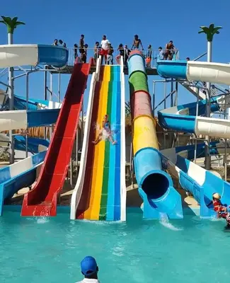 a water park with a slide in the water at فندق فنادير باي in Hurghada