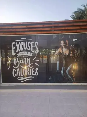 a window with a picture of a woman on it at منتجع سكانديك الغردقة in Hurghada