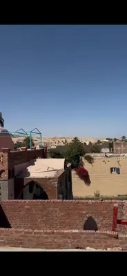 a view from the roof of a brick building at Paradise Apartments in Al Aqālitah