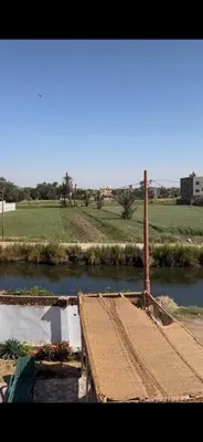 a view of a river with a boat in it at Paradise Apartments in Al Aqālitah