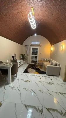 a living room with a couch and a table at Sun Roof in Hurghada