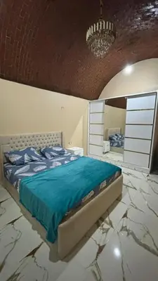 a bedroom with a bed and a mirror at Sun Roof in Hurghada