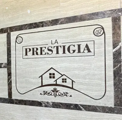 a sign that says la presbyteria on a wall at La Prestigia chalet in Hurghada