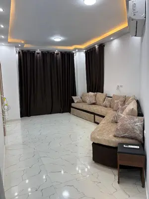 a living room with a couch and a table at La Prestigia chalet in Hurghada