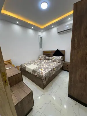 a bedroom with a bed in a room at La Prestigia chalet in Hurghada