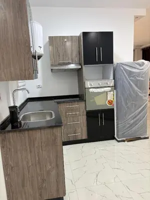 a kitchen with a sink and a stove at La Prestigia chalet in Hurghada