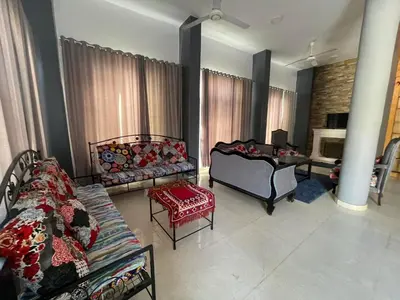 a living room with a couch and a table at Luxor in Al Karnak