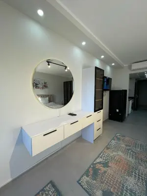 a white bathroom with a mirror and a sink at CHALET IN HURGHADA SCANDIC ReSORT in Hurghada