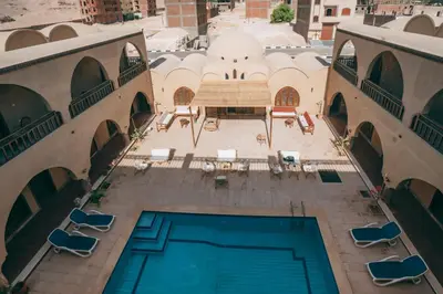 an overhead view of a swimming pool in a building at Sultana Palace in ‘Ezbet Abu Ḥabashi