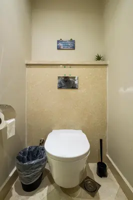 a bathroom with a white toilet in a room at Mangroovy 1BR + Sofa bed • Pool & Beach Access in Hurghada