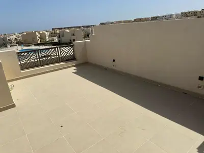 a balcony with a view of a building at Luxury Escape in Hurghada, Egypt in Hurghada