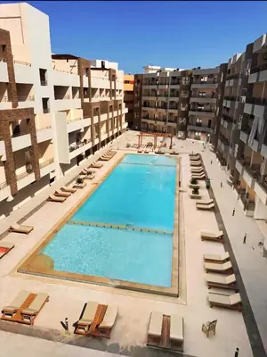 an overhead view of a swimming pool in a building at Hurgada New studio in Avenue on Mamsha -private beach&pool in Hurghada