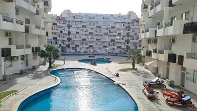 an overhead view of a swimming pool in a building at Sunny Studio Tiba View Red Sea in Hurghada