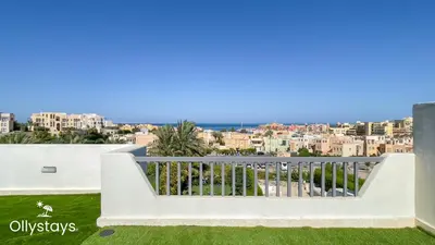 a view of the city from the balcony of a house at Ollystays Seaview Villa 3BR Heated Pool GYM-Joubal El Gouna in Hurghada