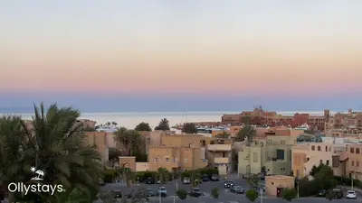 a view of a city with buildings and cars at Ollystays Seaview Villa 3BR Heated Pool GYM-Joubal El Gouna in Hurghada