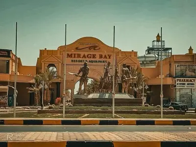 a large building with a statue in front of it at ميراج باي in Hurghada