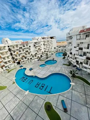 an aerial view of an apartment complex with two pools at Tiba view in Hurghada