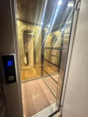 an elevator door with a view of a building at Bostan in Hurghada