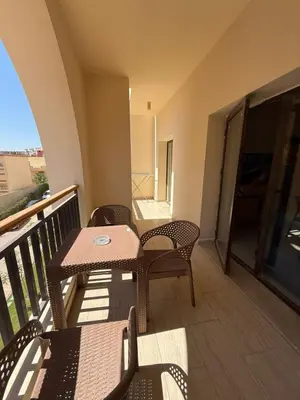 a balcony with a table and chairs on a balcony at Casa bonita in Hurghada
