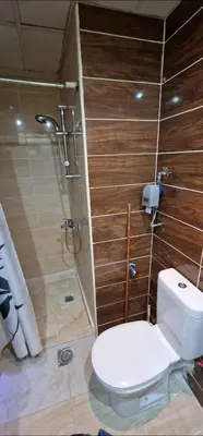 a bathroom with a toilet and a shower at Hurgada Florenza kamsen with pool view in Arabia area in Hurghada