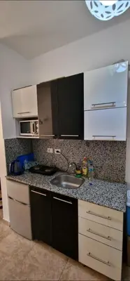 a kitchen with a sink and a counter top at Hurgada Florenza kamsen with pool view in Arabia area in Hurghada